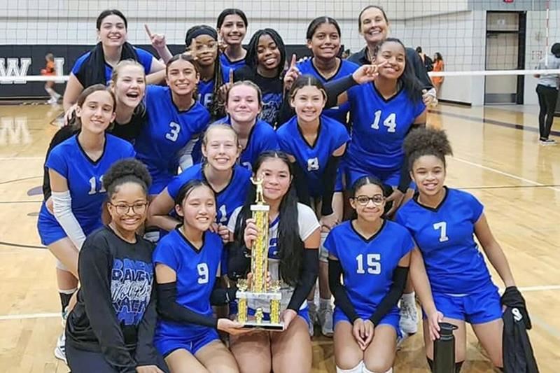 The Anthony Middle School 8B volleyball team poses after defeating Salyards Middle School to win the district championship.